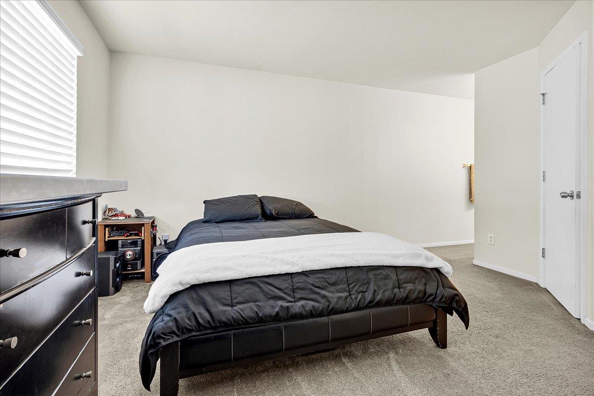 715 Skinner Street Soledad, CA 93960 - Photo 19 of 35 a bedroom with a bed and window