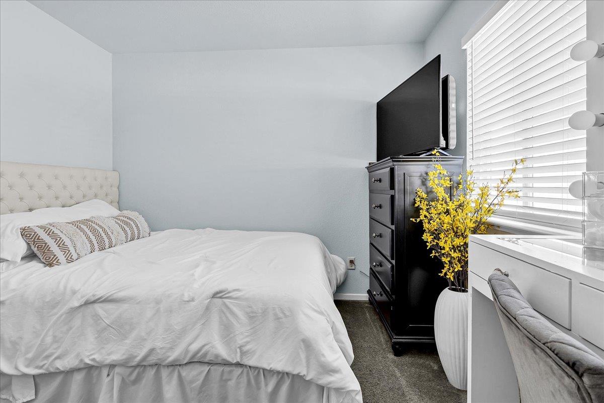 715 Skinner Street Soledad, CA 93960 - Photo 24 of 35 a bedroom with a bed television and a window