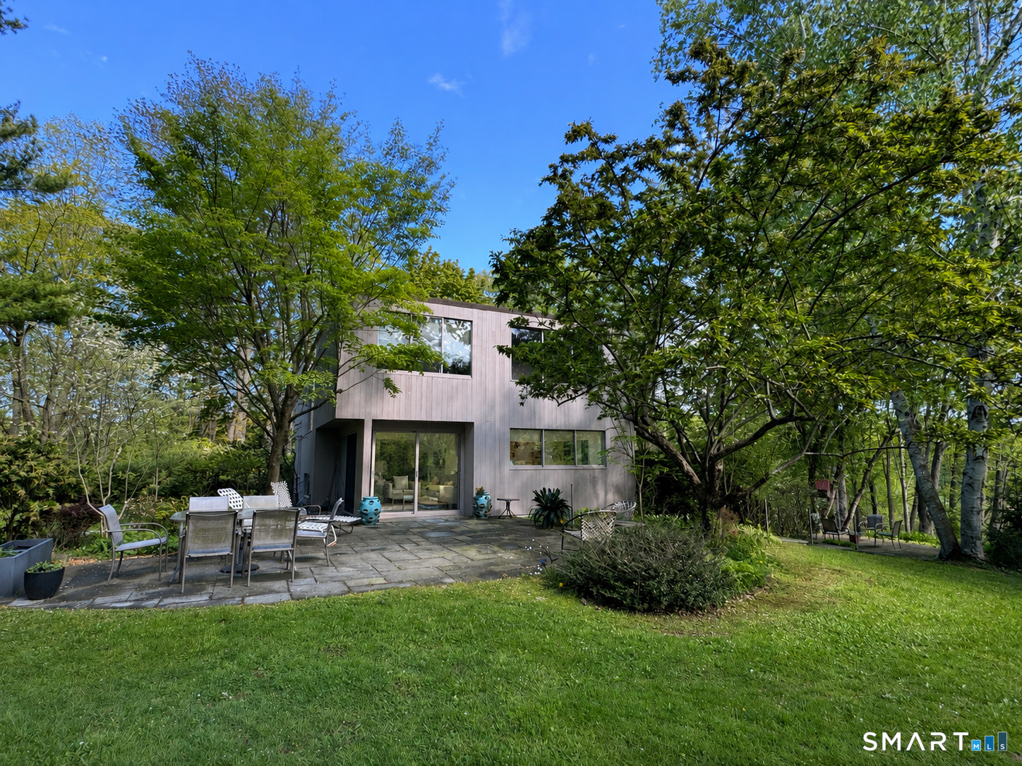 370 R Maiden Lane Durham, CT 06422 - Photo 2 of 28 Tucked into the trees with walls of glass and a backyard that feels like a private resort.