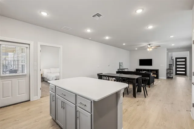 a kitchen with a stove and a refrigerator