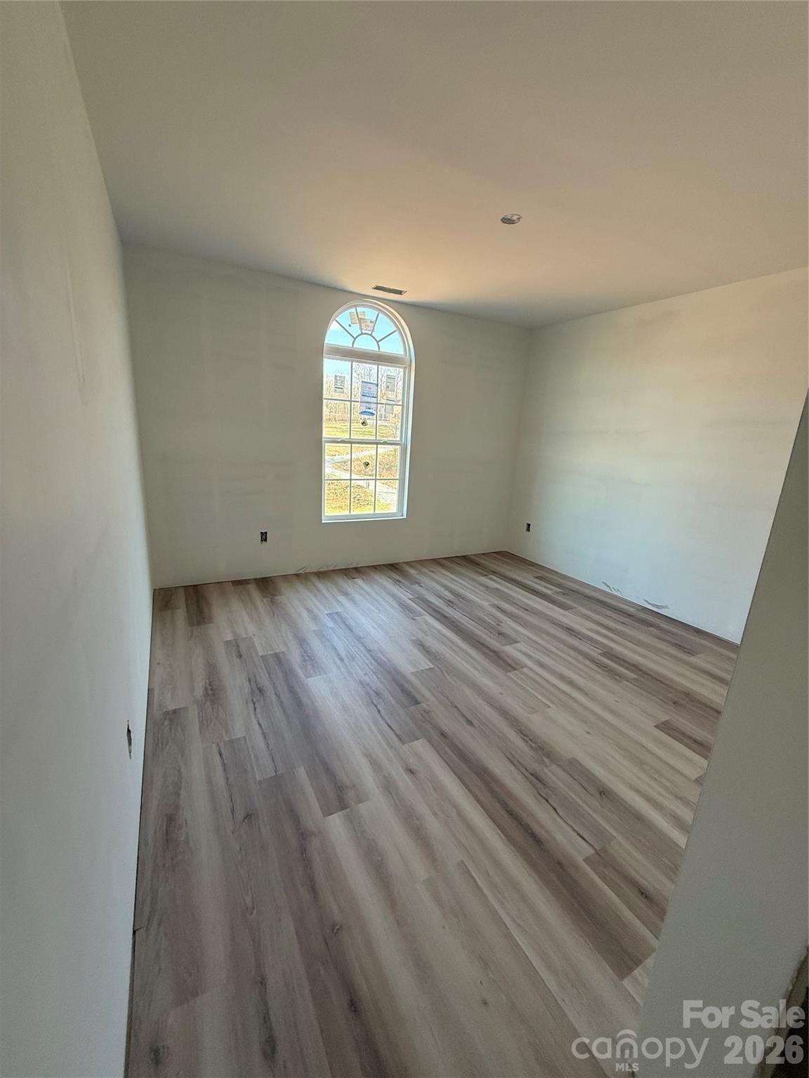 4269 Love Mill Road Stanfield, NC 28163 - Photo 6 of 12 a view of an empty room and a window