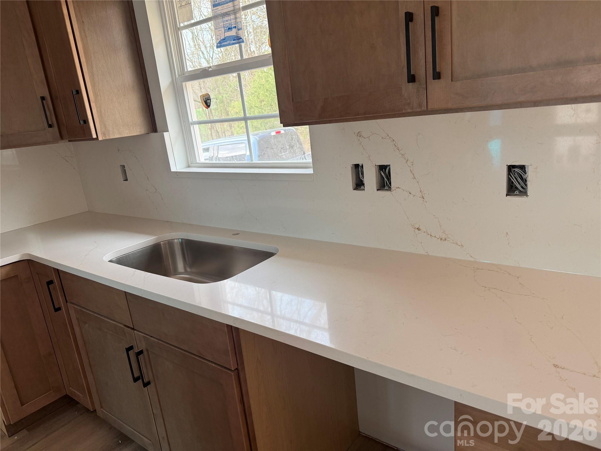 4269 Love Mill Road Stanfield, NC 28163 - Photo 9 of 12 a kitchen with a sink and cabinets