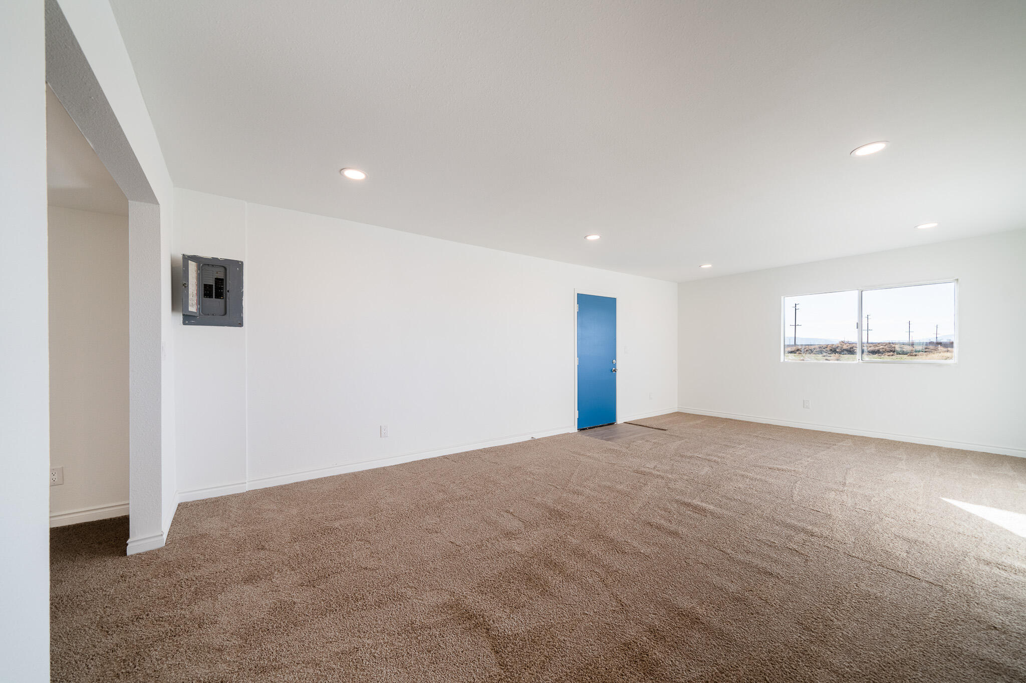 8443 Gaskell Road Rosamond, CA 93560 - Photo 12 of 45 a view of an empty room with a window