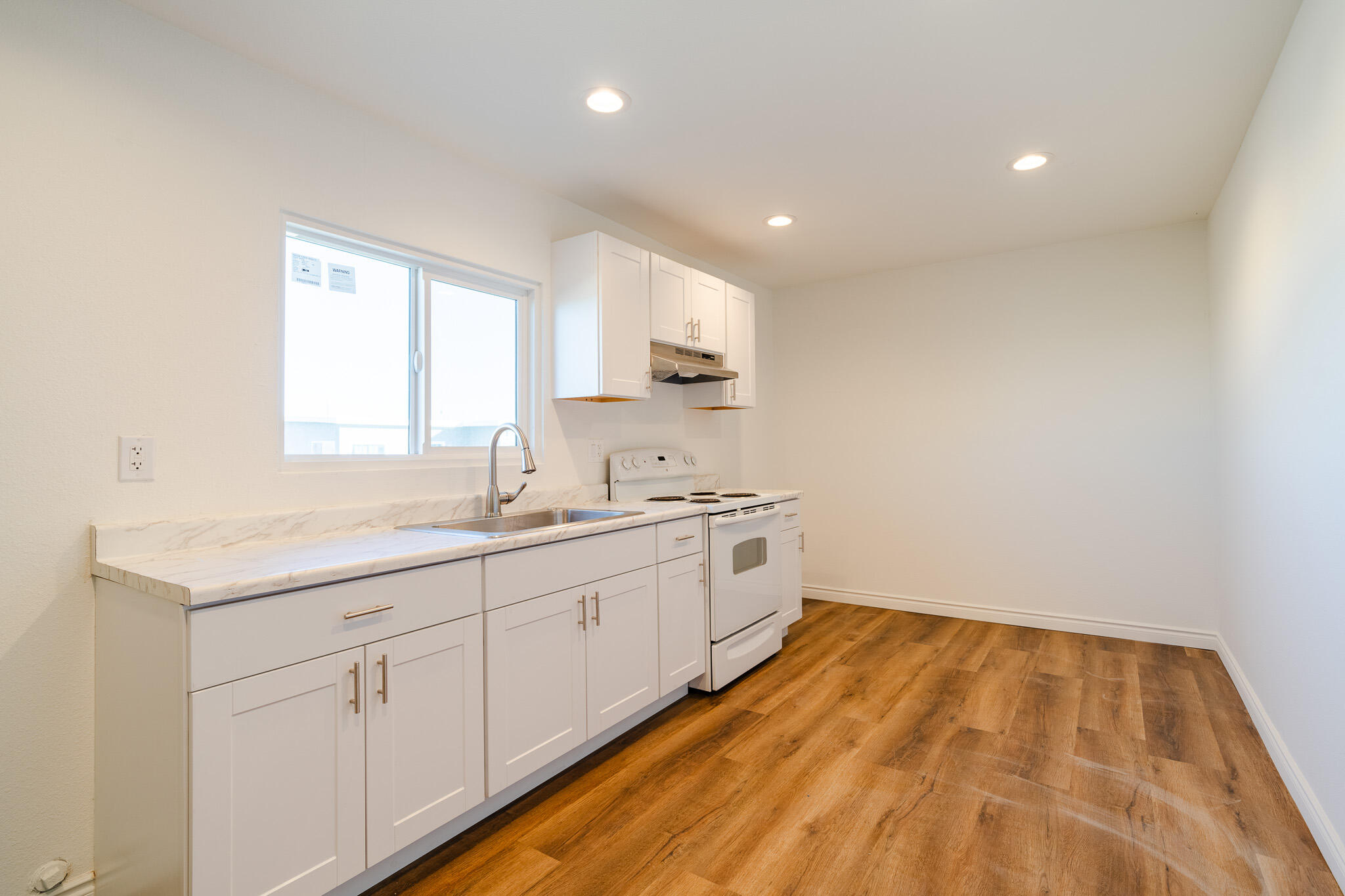8443 Gaskell Road Rosamond, CA 93560 - Photo 18 of 45 a spacious bathroom with a sink and a mirror
