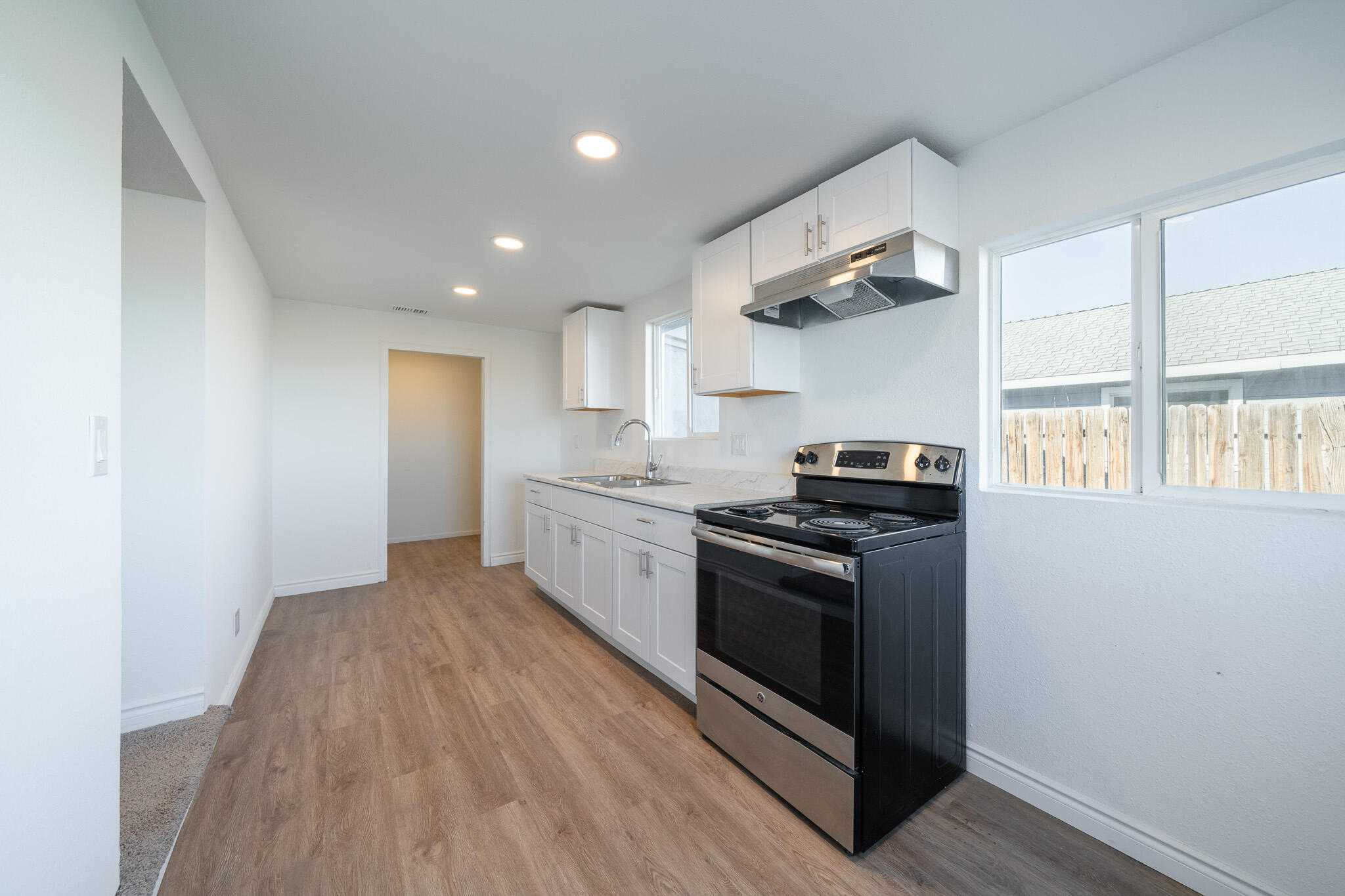 8443 Gaskell Road Rosamond, CA 93560 - Photo 19 of 45 a kitchen with a stove and a refrigerator