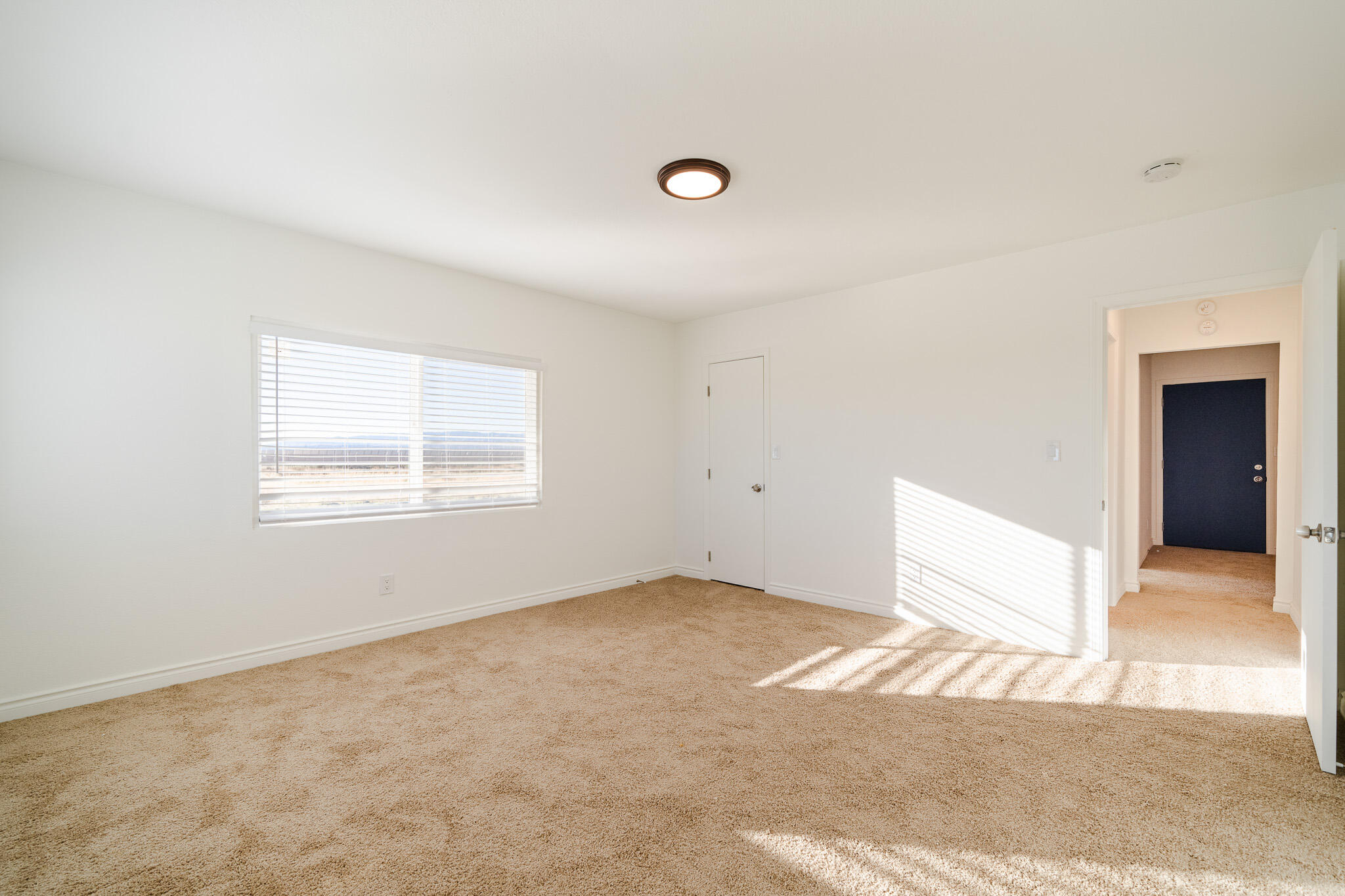 8443 Gaskell Road Rosamond, CA 93560 - Photo 22 of 45 a view of an empty room with a window