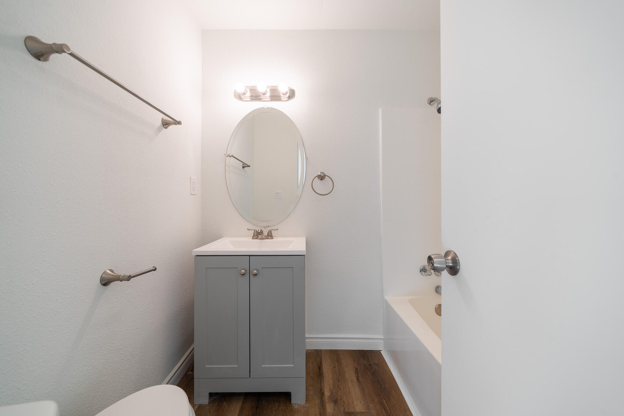 8443 Gaskell Road Rosamond, CA 93560 - Photo 24 of 45 a bathroom with a sink a toilet and mirror