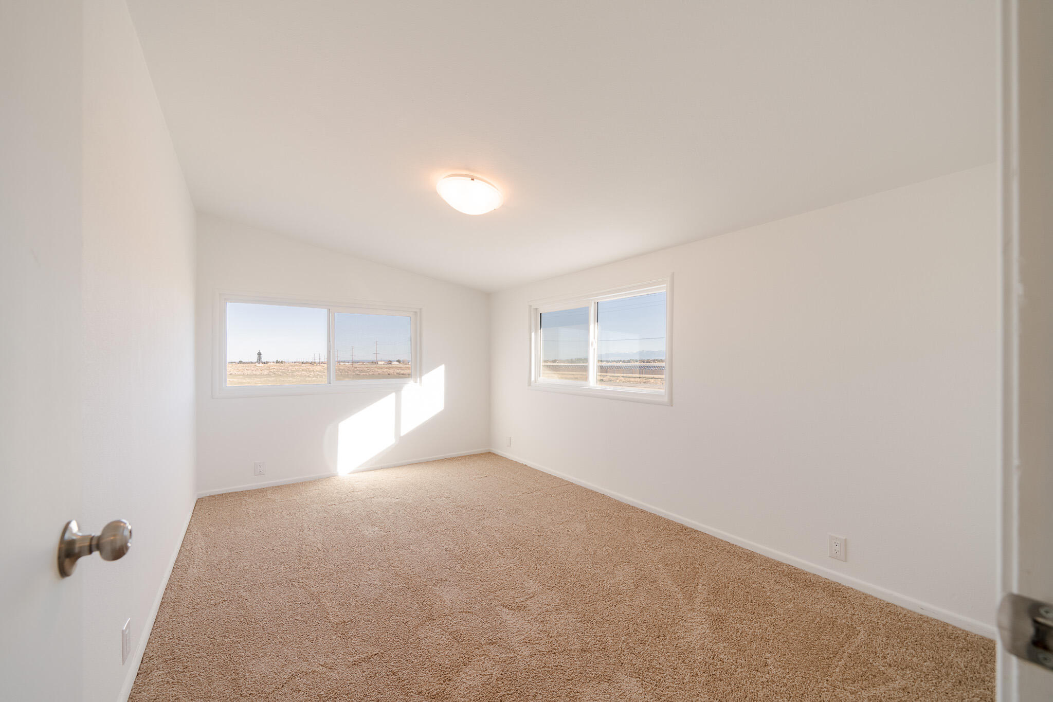 8443 Gaskell Road Rosamond, CA 93560 - Photo 26 of 45 a view of empty room with windows