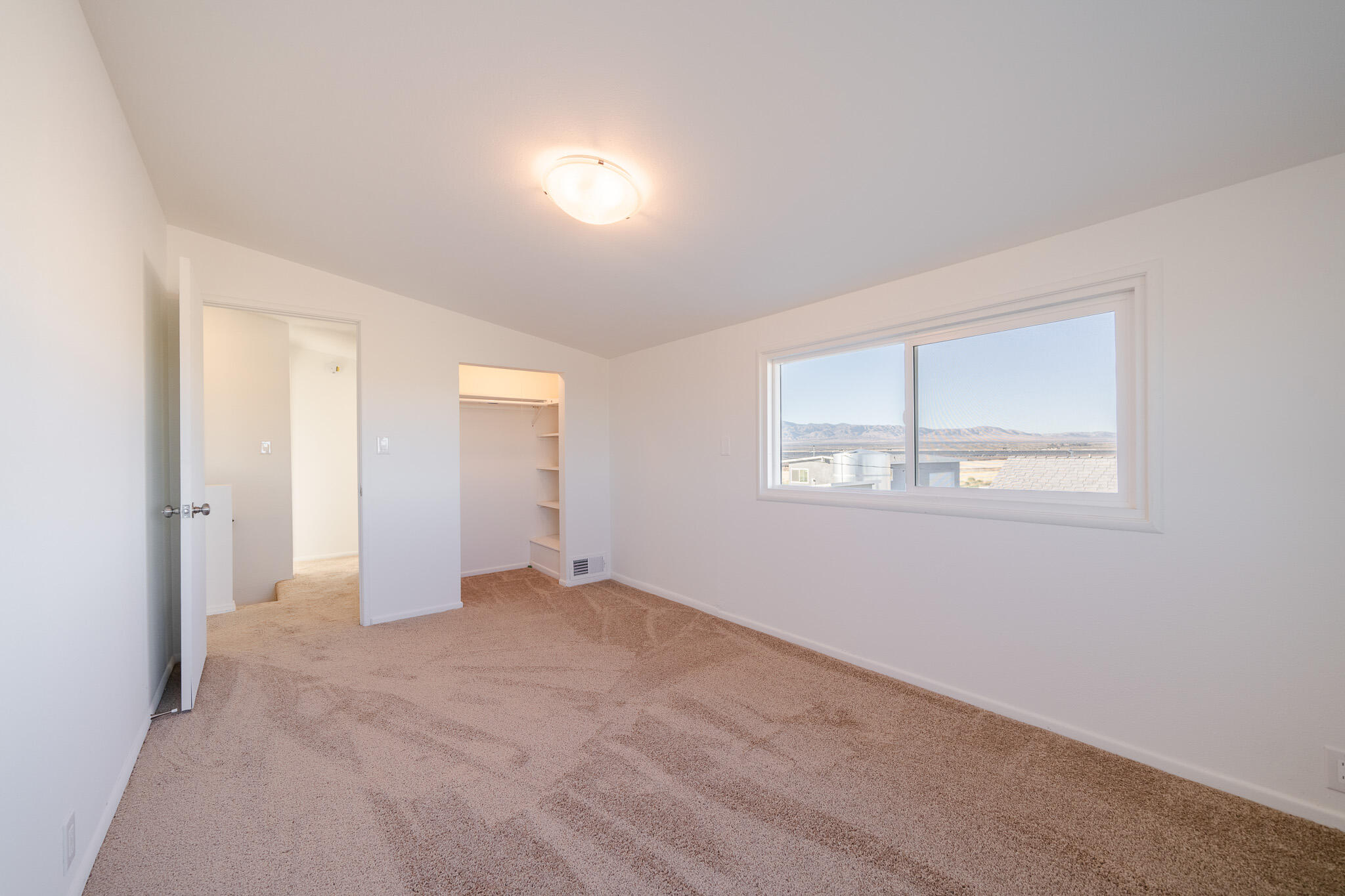 8443 Gaskell Road Rosamond, CA 93560 - Photo 27 of 45 an empty room with windows