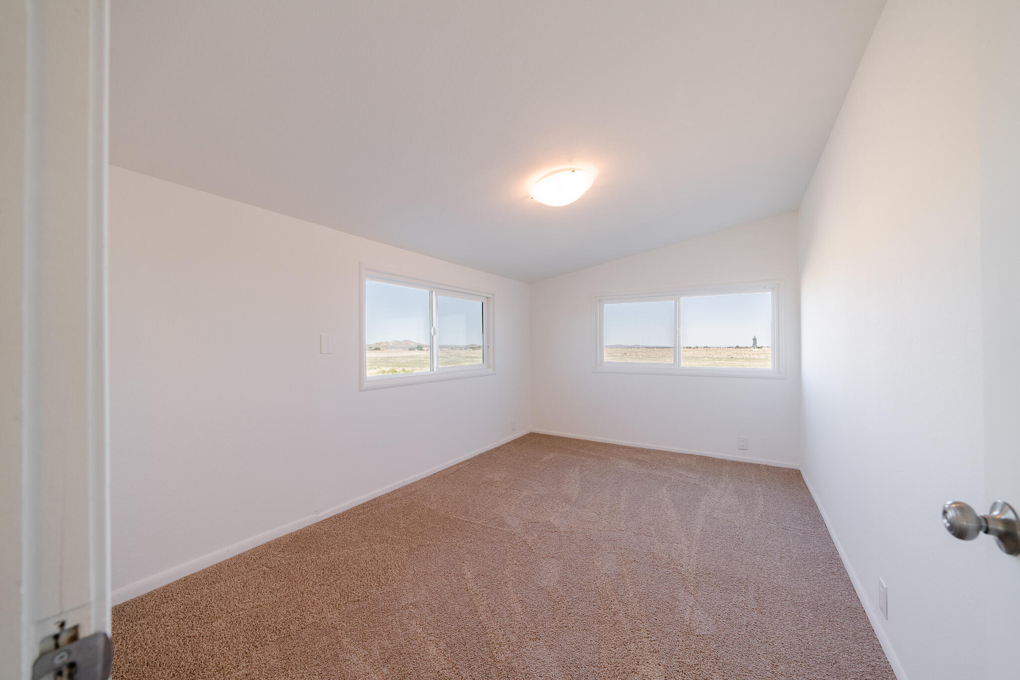 8443 Gaskell Road Rosamond, CA 93560 - Photo 28 of 45 an empty room with a window