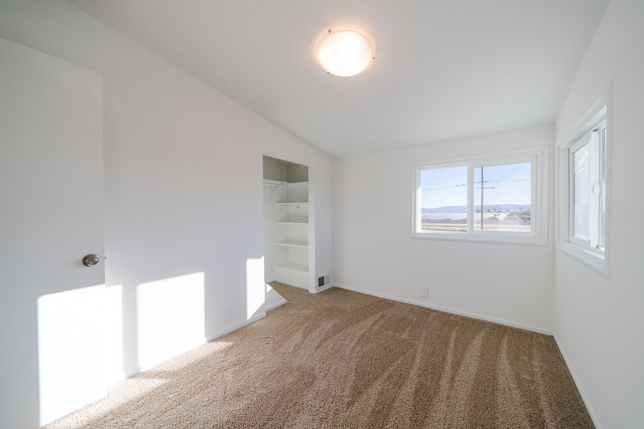 8443 Gaskell Road Rosamond, CA 93560 - Photo 30 of 45 a view of empty room with window