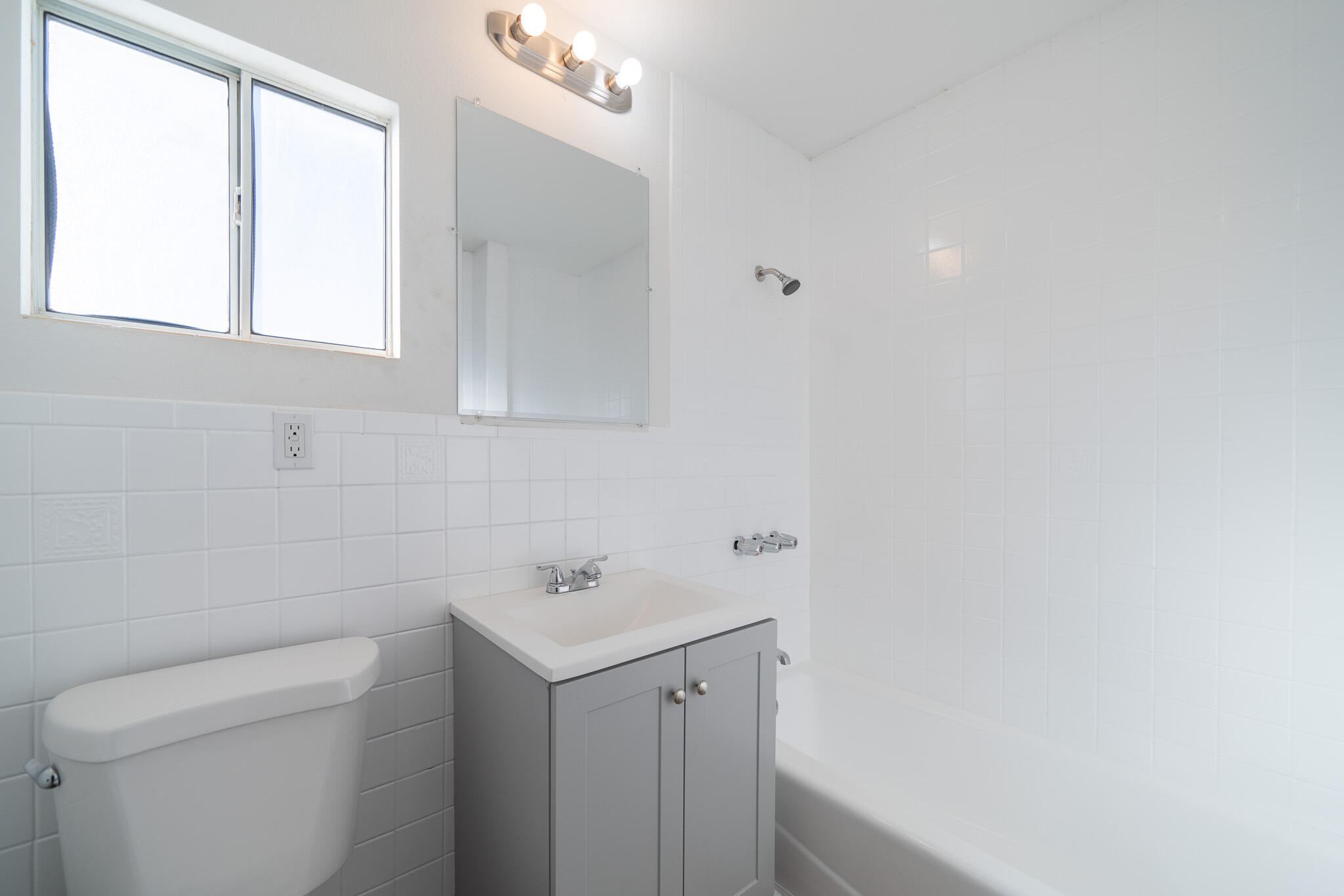 8443 Gaskell Road Rosamond, CA 93560 - Photo 33 of 45 a bathroom with a sink a toilet and a window