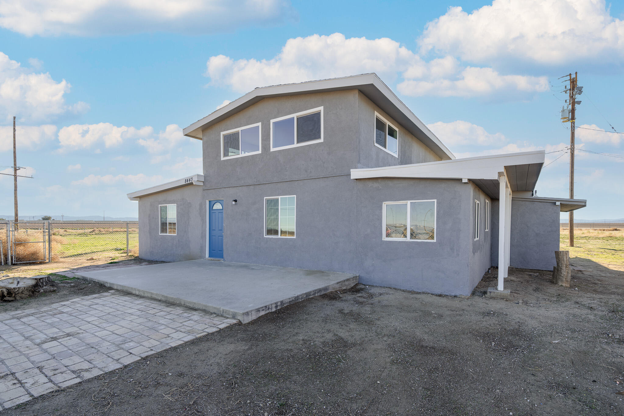 8443 Gaskell Road Rosamond, CA 93560 - Photo 4 of 45 a view of a house with a backyard