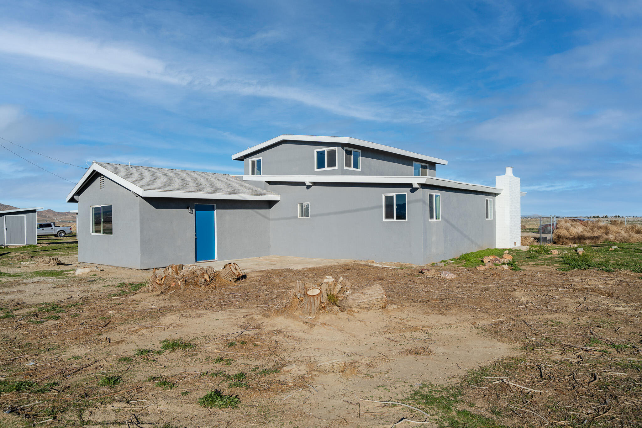 8443 Gaskell Road Rosamond, CA 93560 - Photo 5 of 45 a front view of a house with a yard