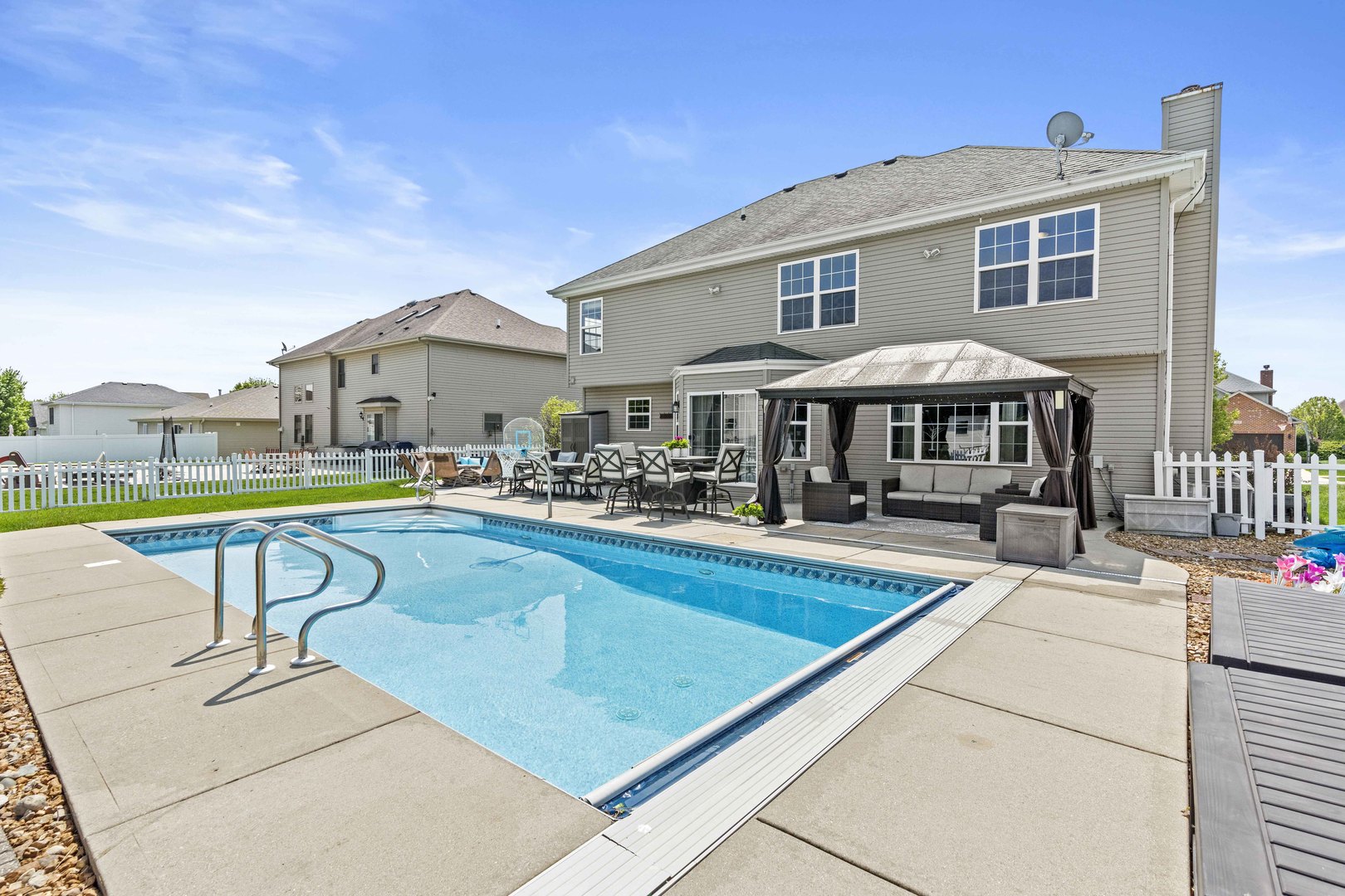253 Aspen Drive Beecher, IL 60401 - Photo 3 of 17 a view of a house with pool and chairs