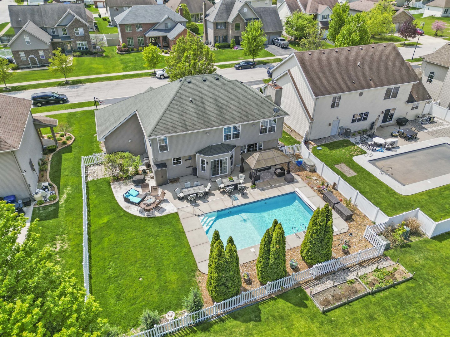 253 Aspen Drive Beecher, IL 60401 - Photo 8 of 17 an aerial view of a house with backyard swimming pool and outdoor seating
