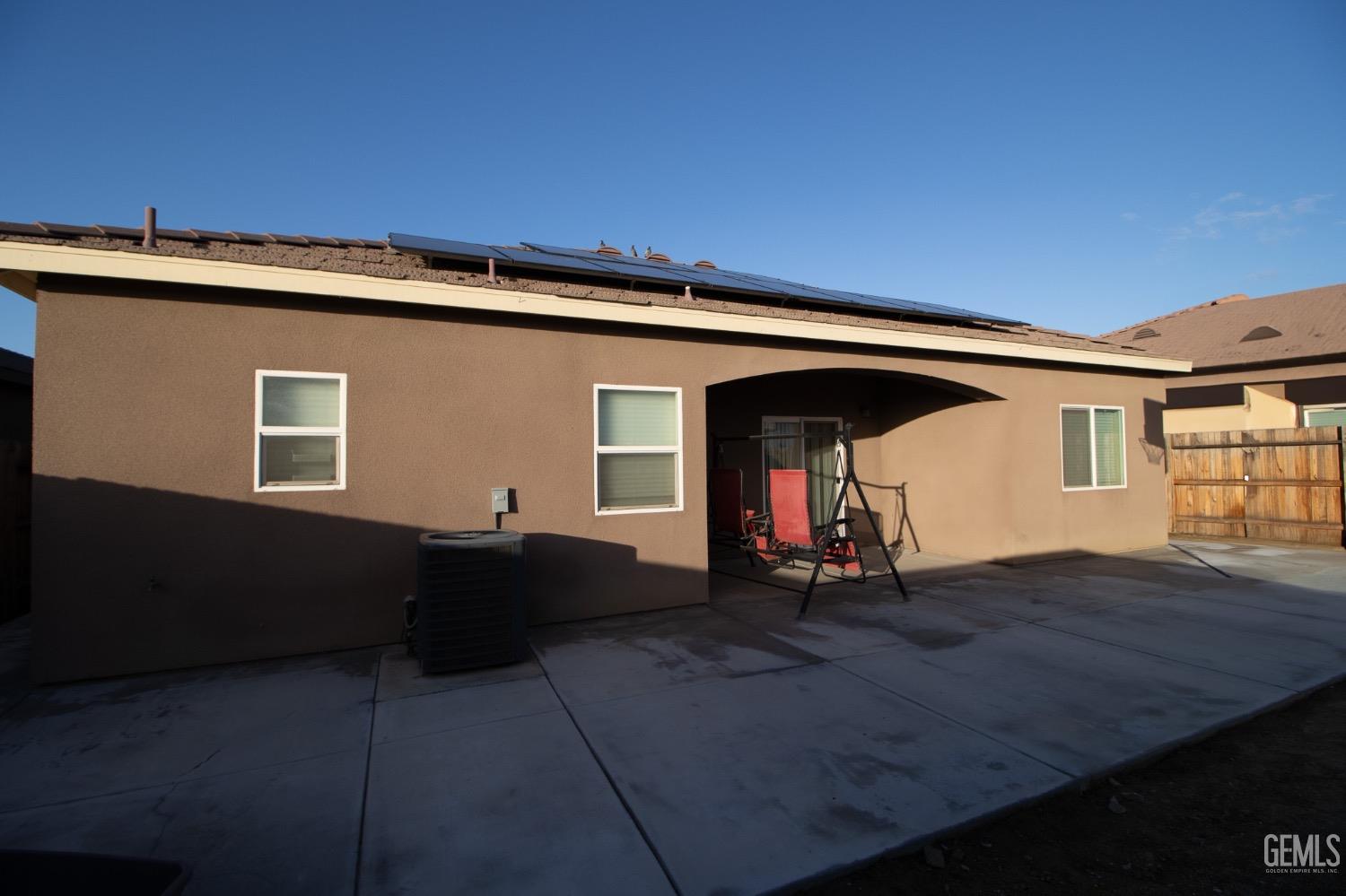 Undisclosed Address Wasco, CA 93280 - Photo 15 of 19 a view of backyard with deck and wooden floor