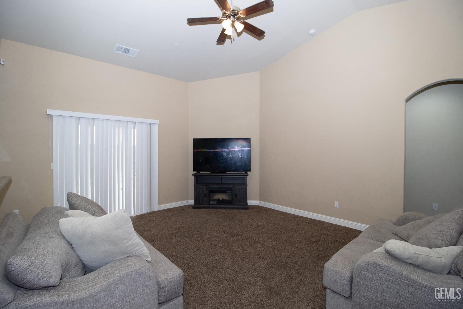 Undisclosed Address Wasco, CA 93280 - Photo 6 of 19 a living room with furniture and a window