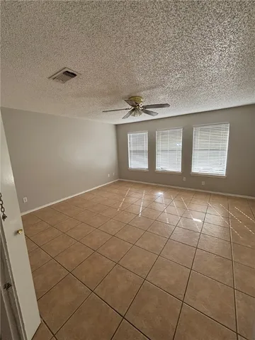 a view of a livingroom with wooden floor and a window