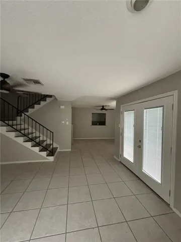 a view of a livingroom with a staircase