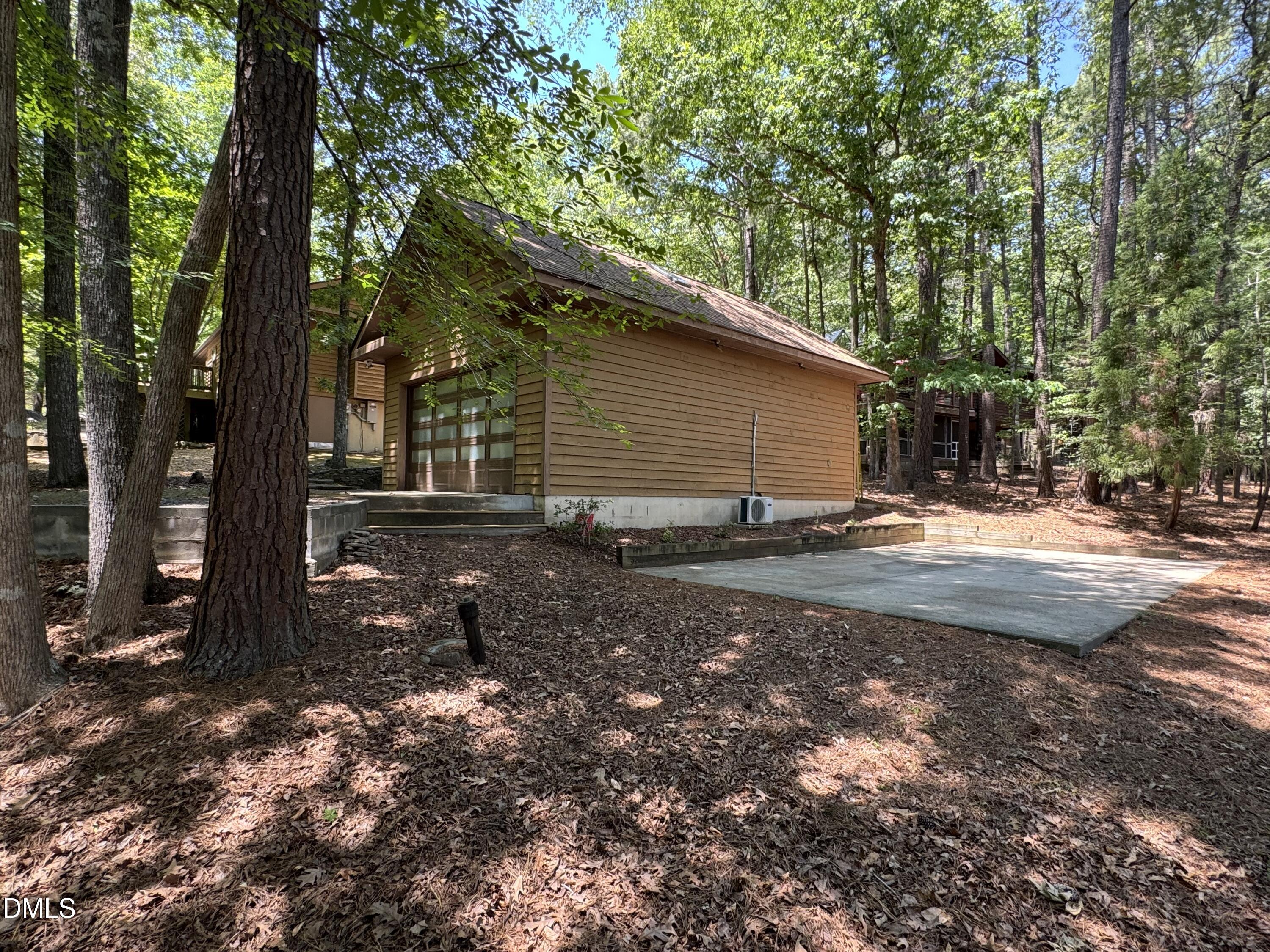 200 Spring Valley Road Carrboro, NC 27510 - Photo 27 of 38 a backyard of a house with lots of green space
