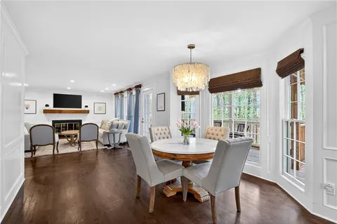 a kitchen with a refrigerator sink and cabinets