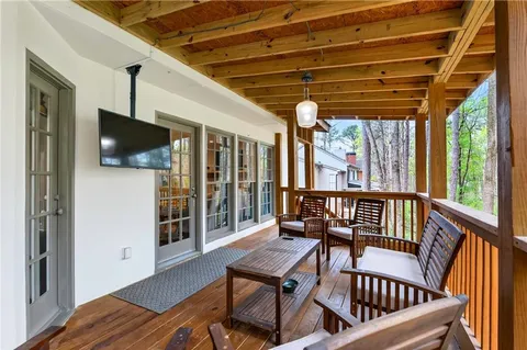 a view of a chairs in wooden deck