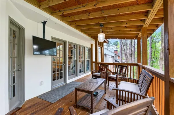 a view of a chairs in wooden deck