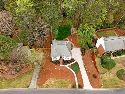 an aerial view of residential houses with outdoor space