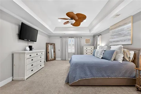 a bathroom with a toilet and a shower curtain