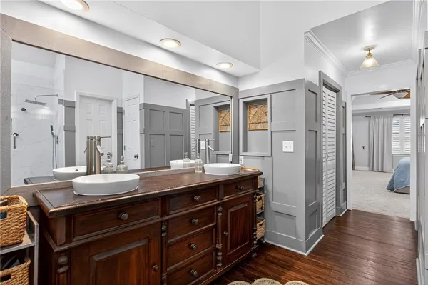 a bathroom with a double vanity sink and a mirror