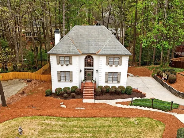 a view of house with yard