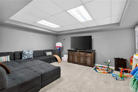 a view of a patio with table and chairs with wooden floor and fence