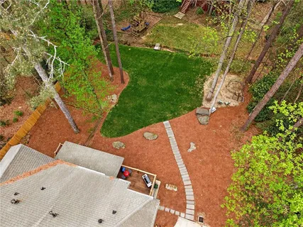 a view of a park with large trees