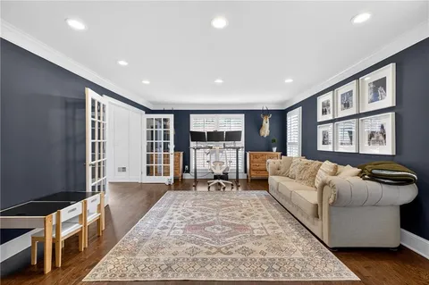 a living room with furniture window and wooden floor