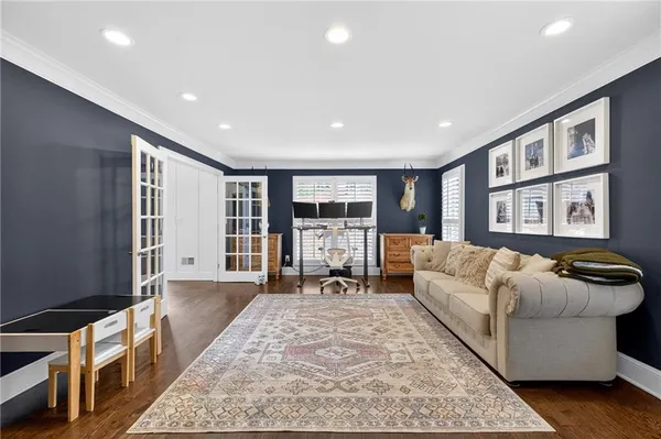 a living room with furniture and large window