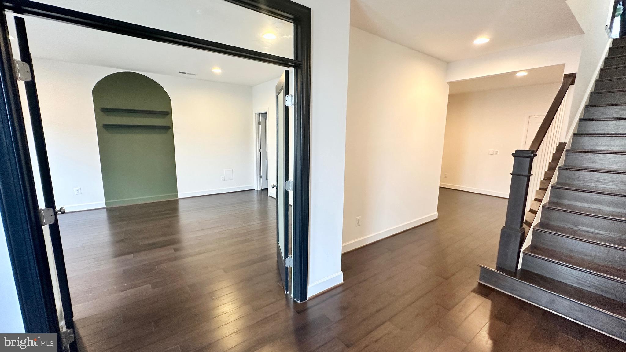 20265 Oak Bluff Drive Ashburn, VA 20147 - Photo 4 of 42 a view of a hallway with wooden floor