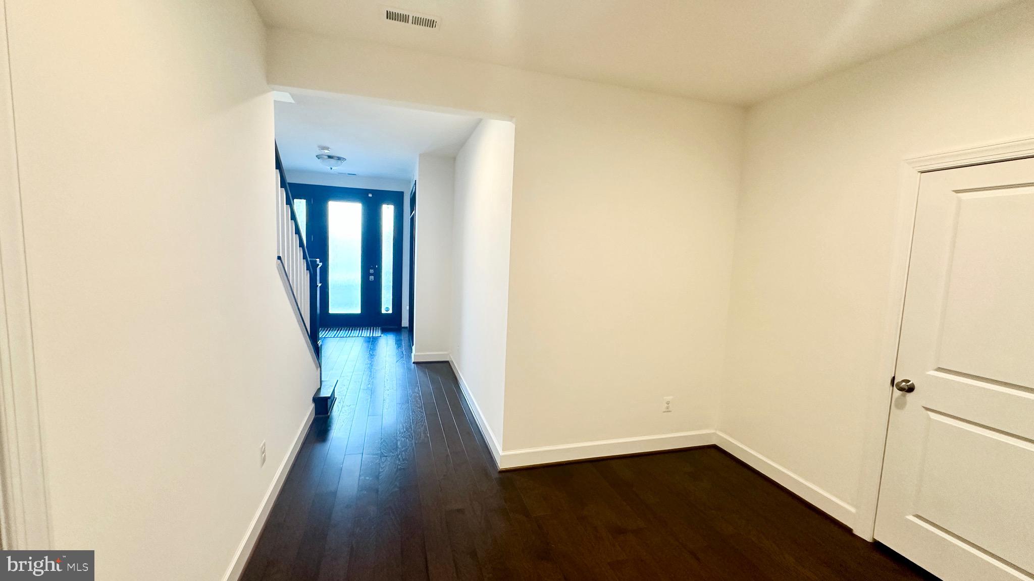 20265 Oak Bluff Drive Ashburn, VA 20147 - Photo 5 of 42 a view of a hallway with wooden floor