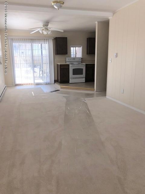 129 Queen Ann Road Brick, NJ 08723 - Photo 17 of 20 Downstairs living, kitchen, slider