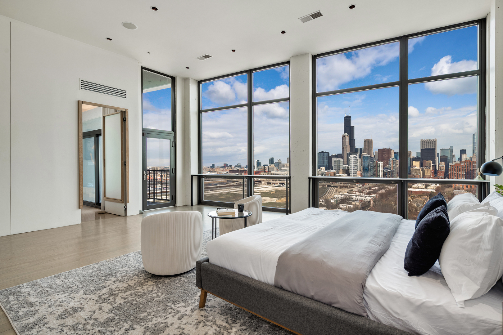1530 South State Street, Unit 18AB Chicago, IL 60605 - Photo 16 of 54 a bedroom with a large bed and a large window