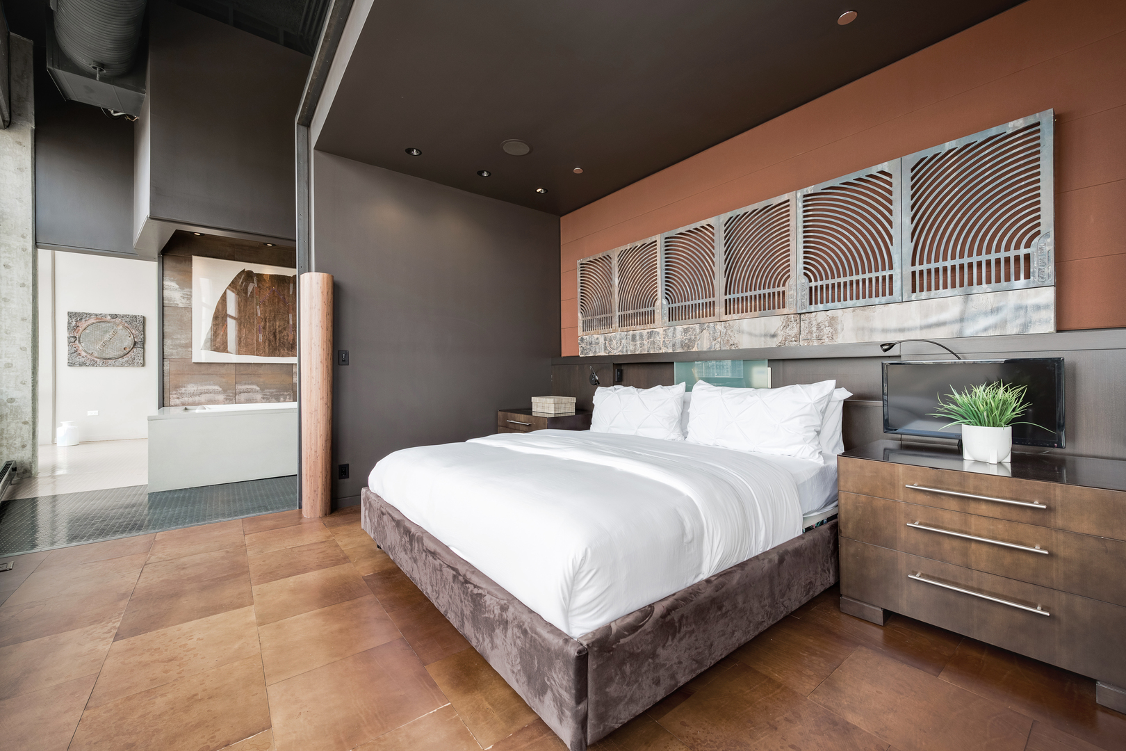 1530 South State Street, Unit 18AB Chicago, IL 60605 - Photo 26 of 54 a bedroom with a bed and a refrigerator