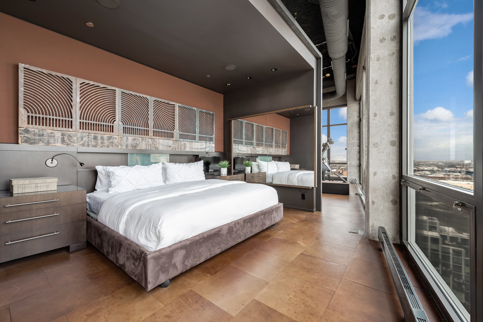 1530 South State Street, Unit 18AB Chicago, IL 60605 - Photo 27 of 54 a spacious bedroom with a bed and a large window