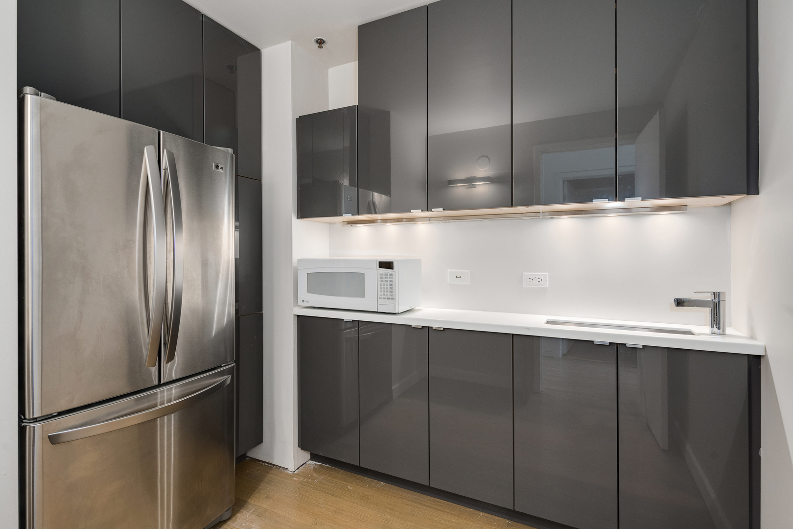 1530 South State Street, Unit 18AB Chicago, IL 60605 - Photo 35 of 54 a kitchen with a refrigerator and a sink