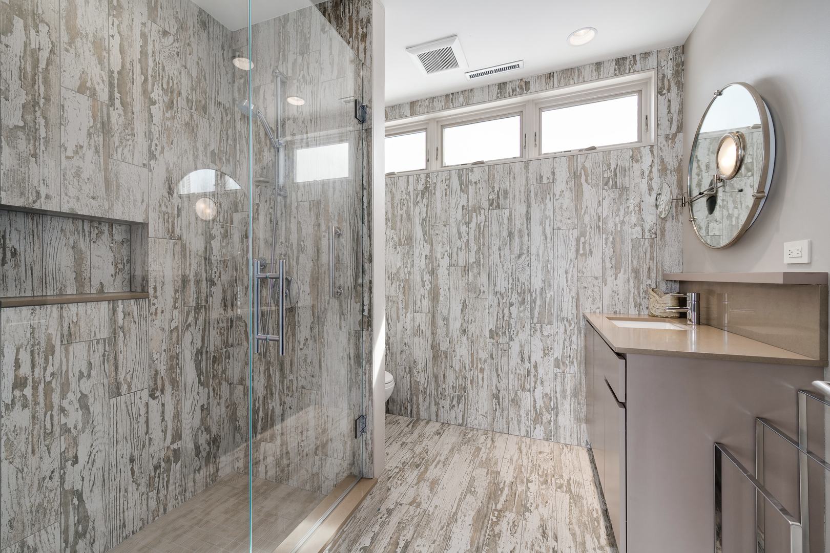 1530 South State Street, Unit 18AB Chicago, IL 60605 - Photo 40 of 54 a bathroom with a toilet a sink and a large mirror