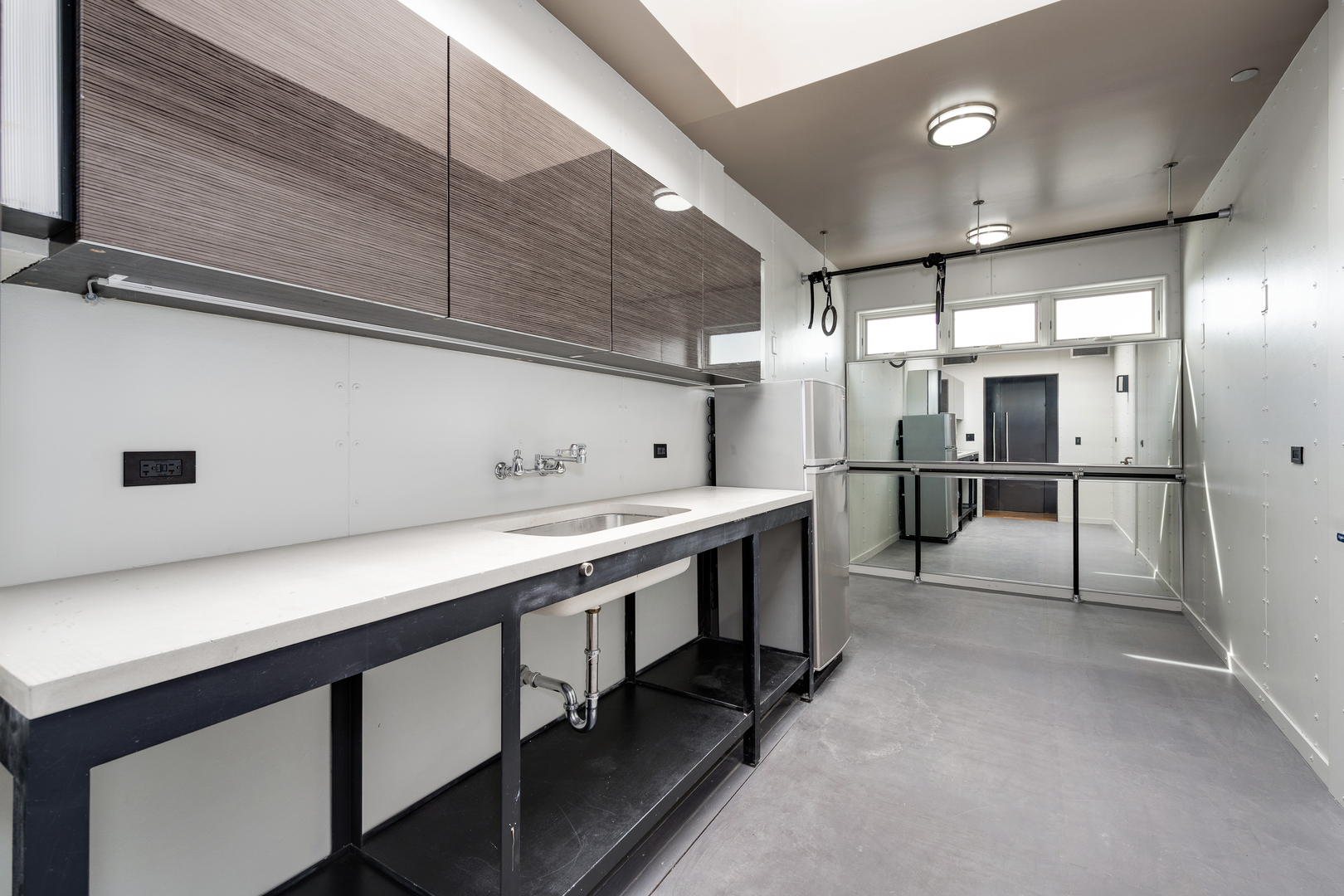 1530 South State Street, Unit 18AB Chicago, IL 60605 - Photo 41 of 54 a kitchen with stainless steel appliances sink refrigerator and microwave