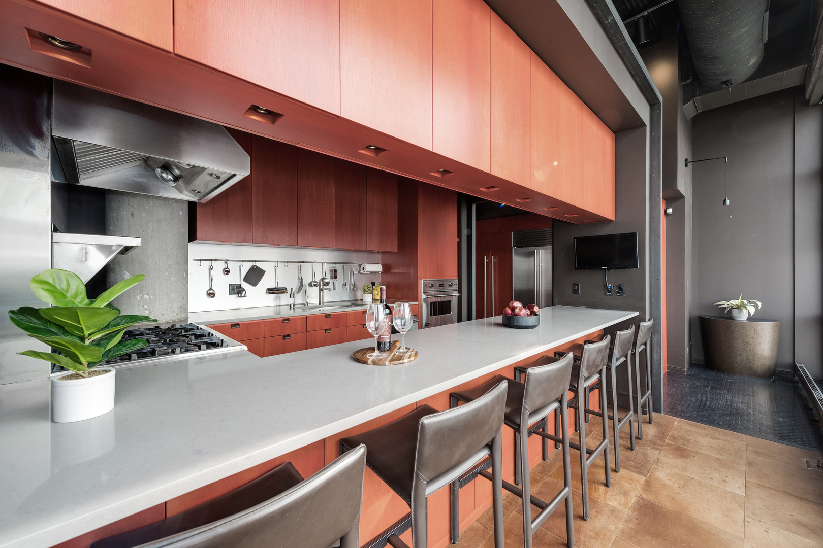 1530 South State Street, Unit 18AB Chicago, IL 60605 - Photo 10 of 54 a room with stainless steel appliances kitchen island granite countertop a table chairs in it and wooden floor