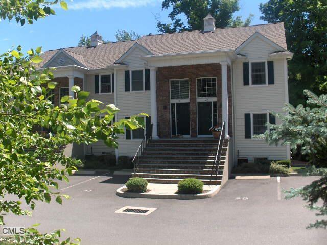 570 Danbury Road, Unit 20 Ridgefield, CT 06877 - Photo 1 of 1 a front view of a house with garden