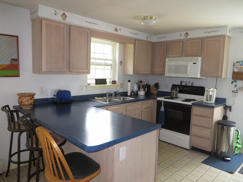 650 Townhouse Road East Waterboro, ME 04030 - Photo 2 of 19 Kitchen with electric range and...