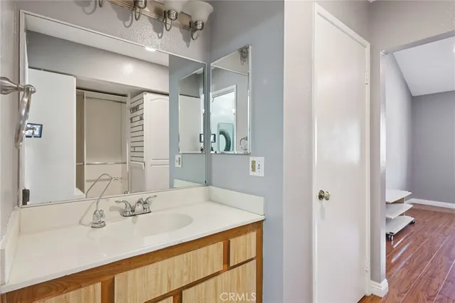 a bathroom with a sink and a mirror