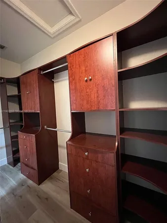 a room with furniture and wooden walls